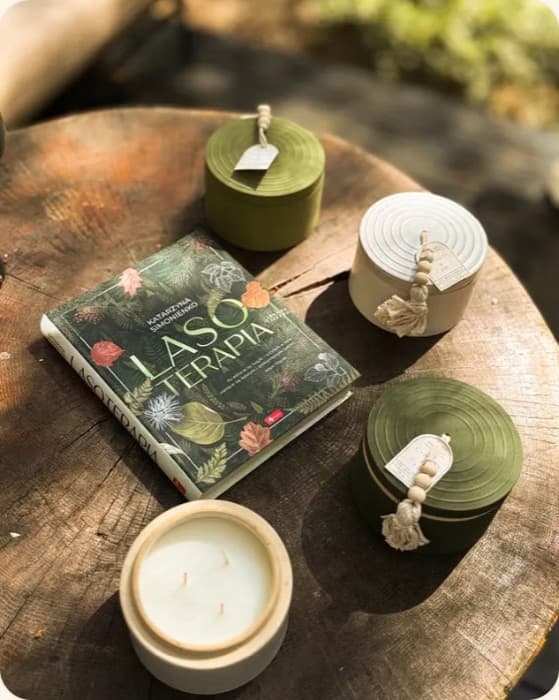 Candles from the forest scents collection on a tree stump
