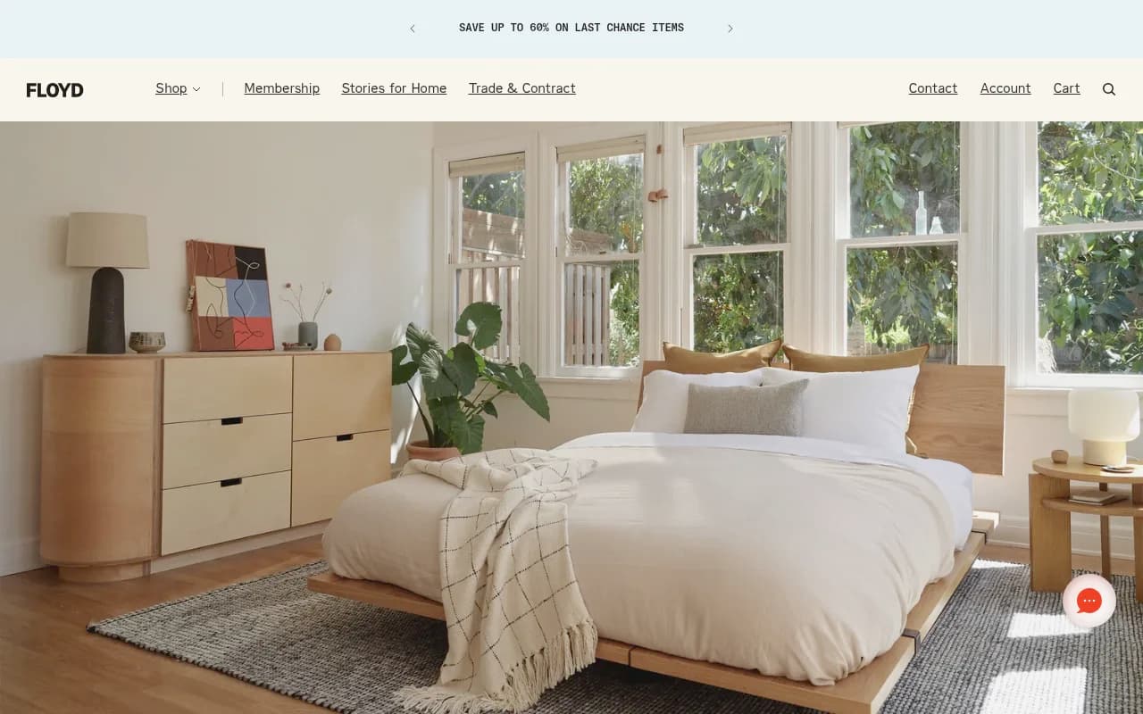 Floyd homepage showing a minimalist bedroom with a wooden platform bed and dresser