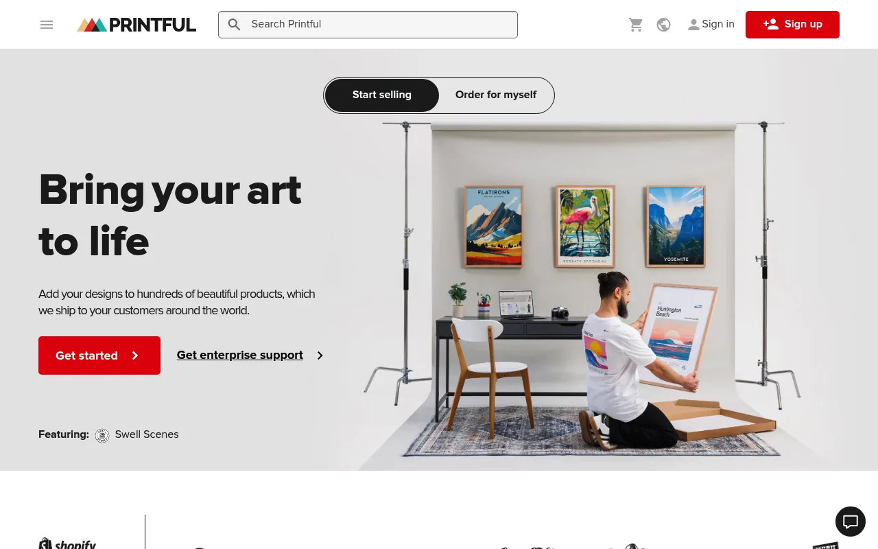 Printful homepage showing print-on-demand product mockups