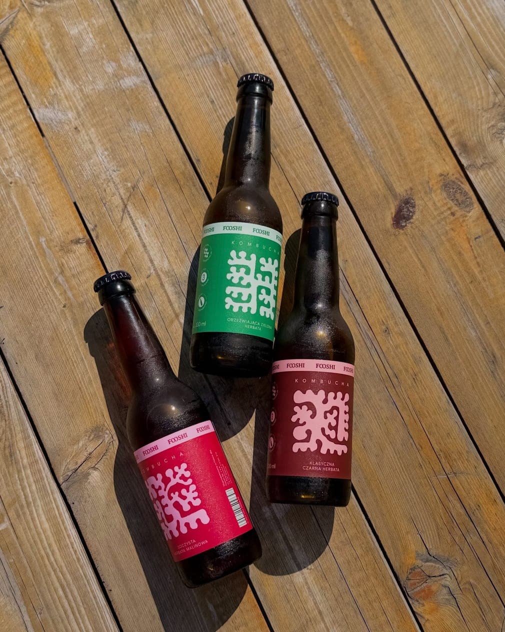 Three Fooshi bottles on wooden boards