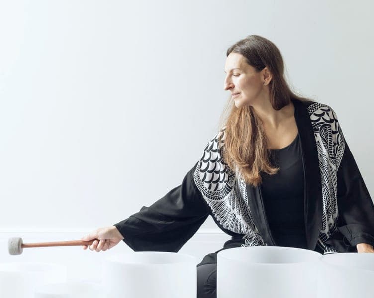 Anna playing crystal singing bowls